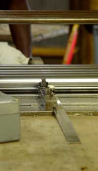 Feeding a metal strip into the flattening mill.